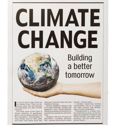 Newspaper clipping (simulated) about solutions to the climate crisis. Text was written from scratch by the photographer, who also did the design, so this image is free of third-party copyright and may be used without restriction. The text is coherent and every effort has been made to ensure accuracy, but no claims about it are made. Public domain satellite Earth image from https://www.nasa.gov/multimedia/imagegallery/image_feature_2159.html